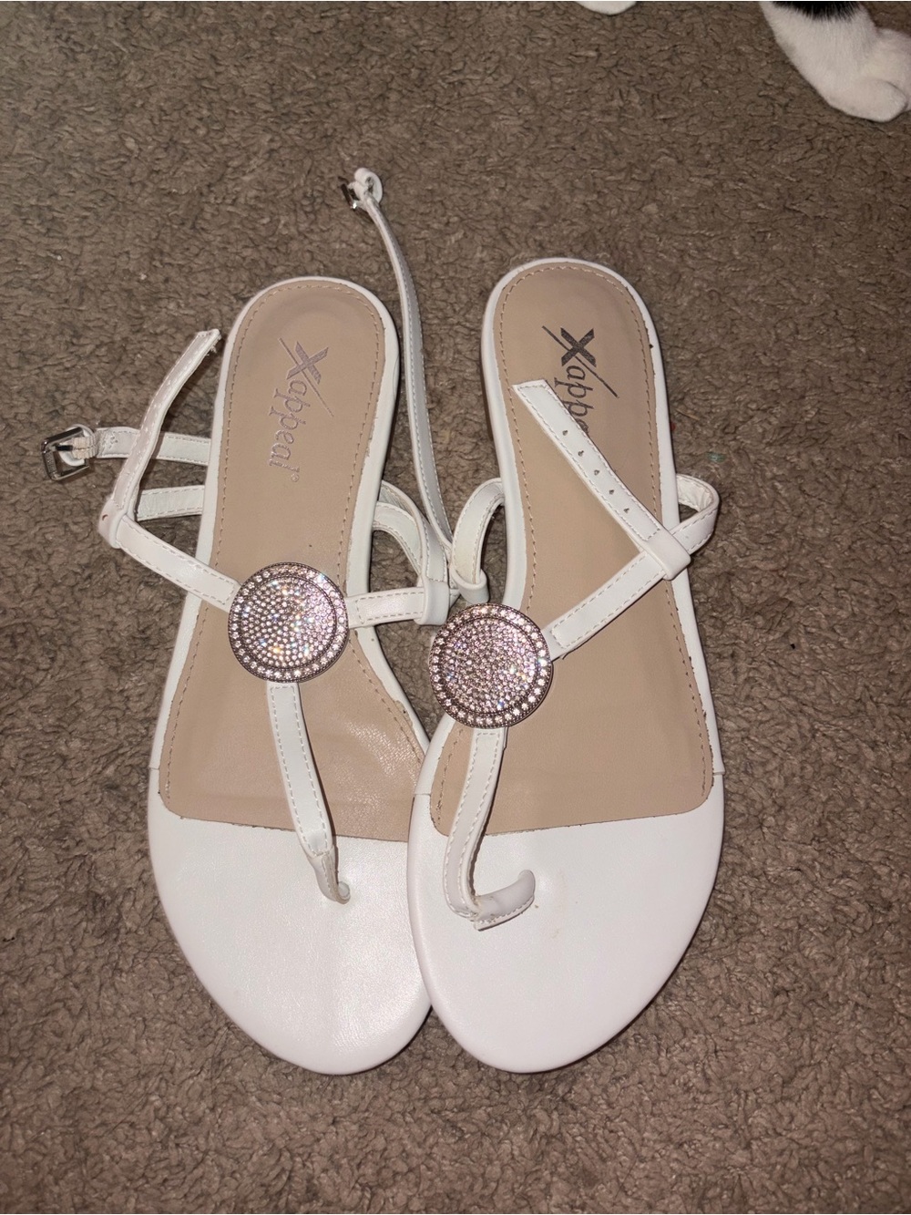Xappeal White T-Strap Sandals with Rhinestone Disc